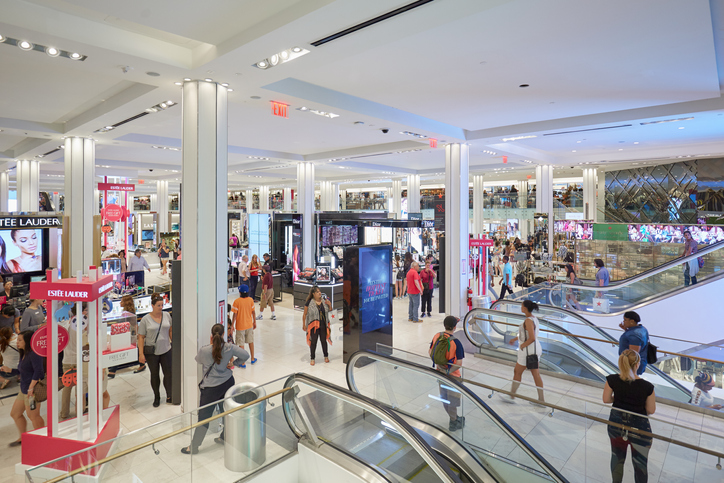 Macy's department store interior, cosmetics area with escalators in New York