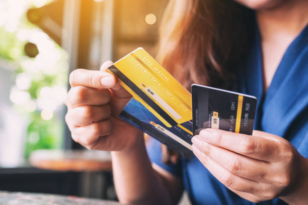 woman holding and choosing credit card 