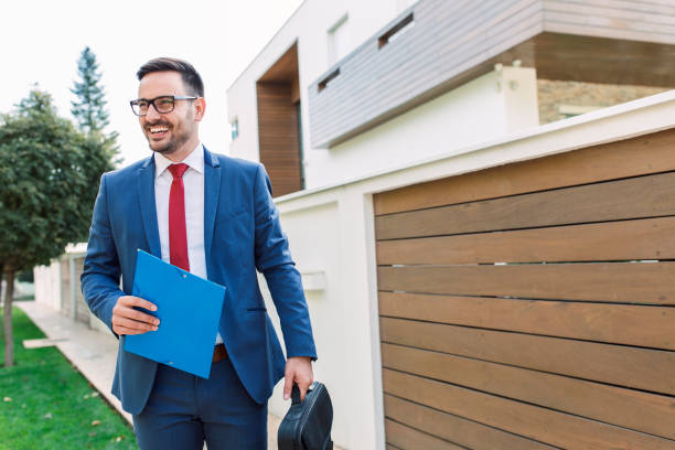 Smiling modern young businessman going to work