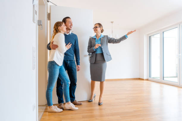 female realtor with young couple